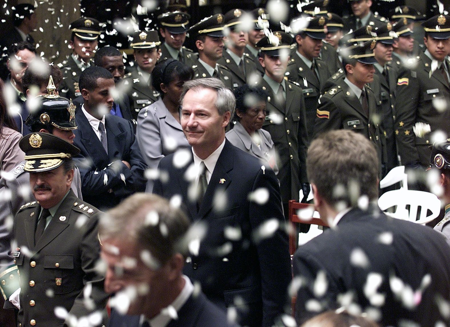 Flower petals rain down on Hutchinson as he arrives at the national police headquarters in Bogotá in March 2002.