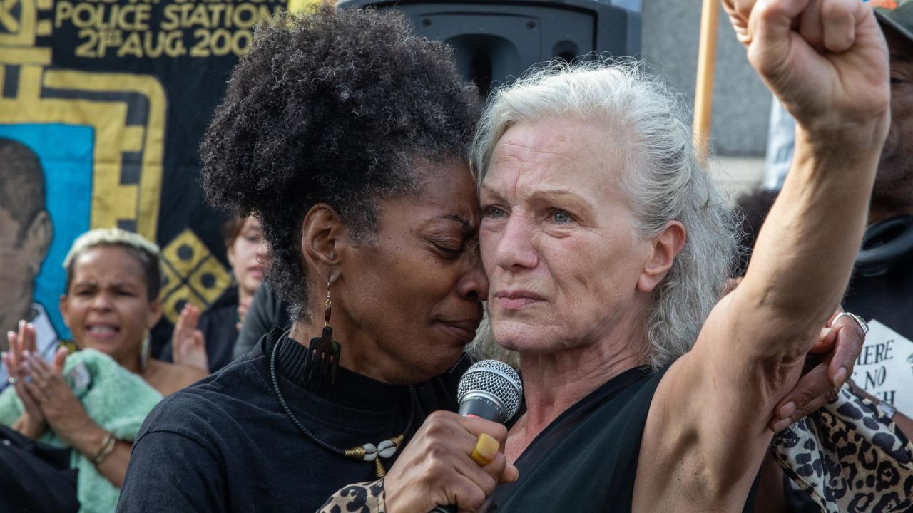 At a protest in London, Marcia Rigg embraces Carole Duggan, whose nephew Mark Duggan was shot dead by the police in 2011. 