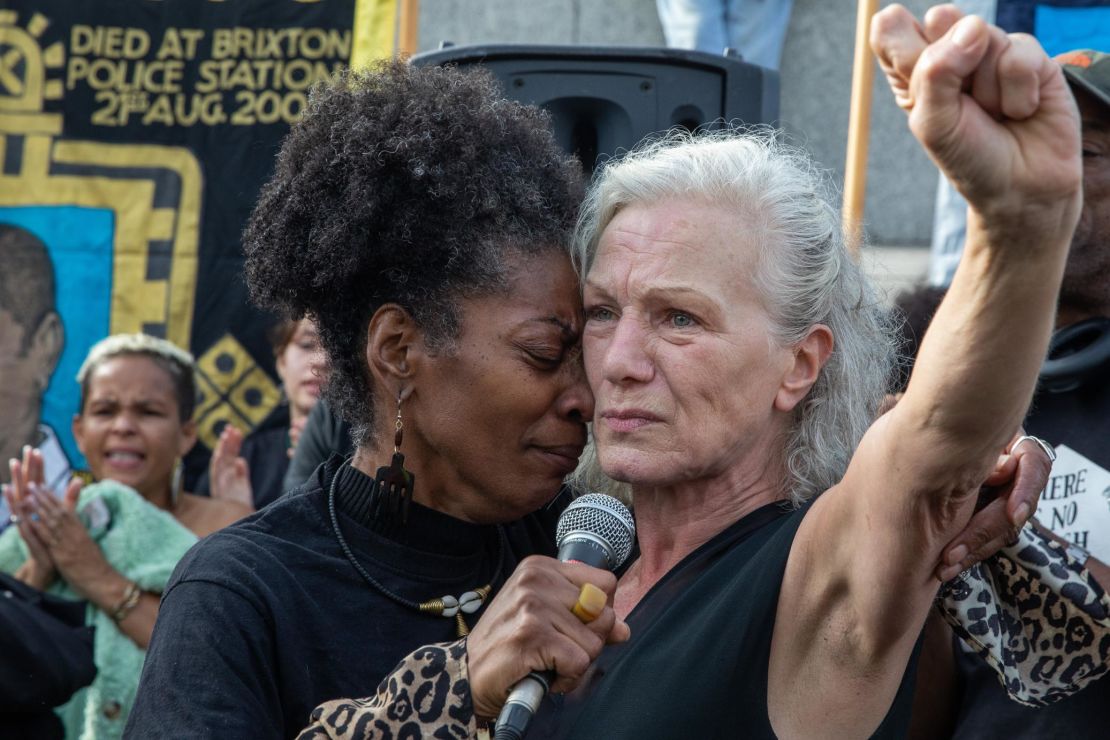 At a protest in London, Marcia Rigg embraces Carole Duggan, whose nephew Mark Duggan was shot dead by the police in 2011. 