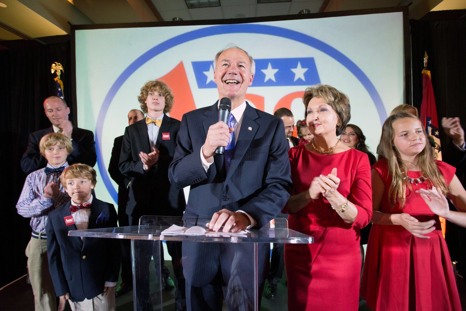 Hutchinson — with his wife, Susan, and other family members by his side — gives a speech after being elected governor of Arkansas in November 2014.