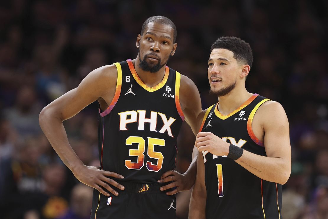 Durant and Booker talk during the second half of Game 2.  