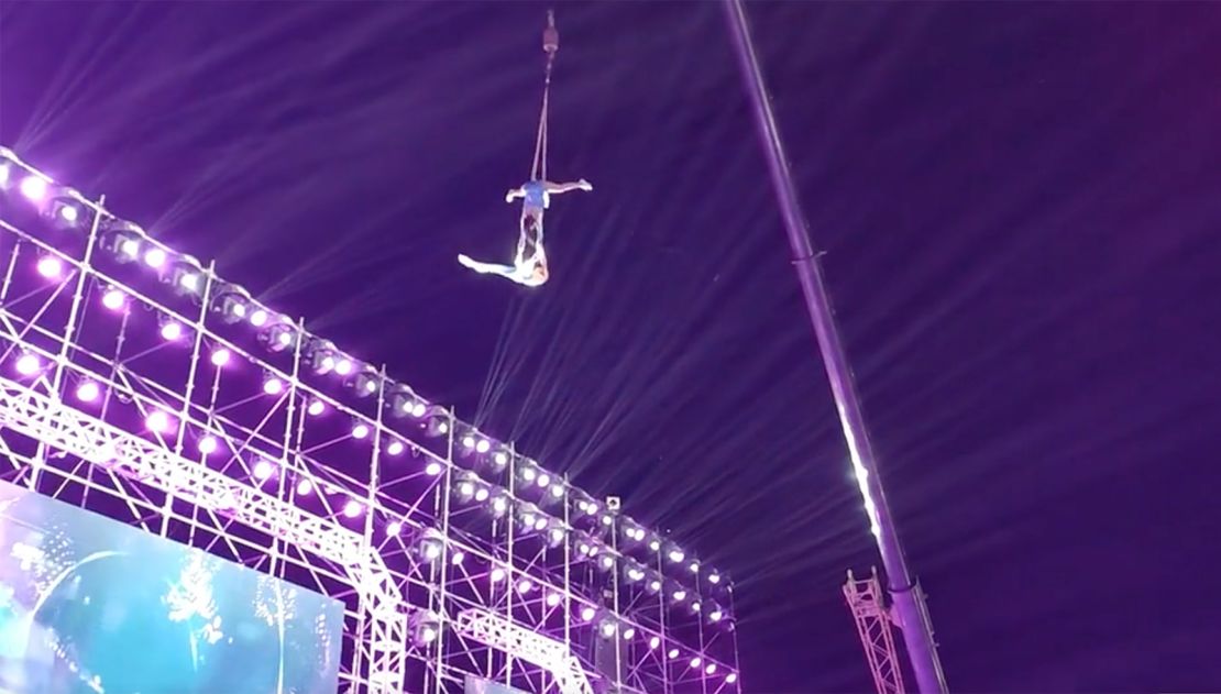 The acrobat couple are seen performing another set of aerial silks routine before the accident.