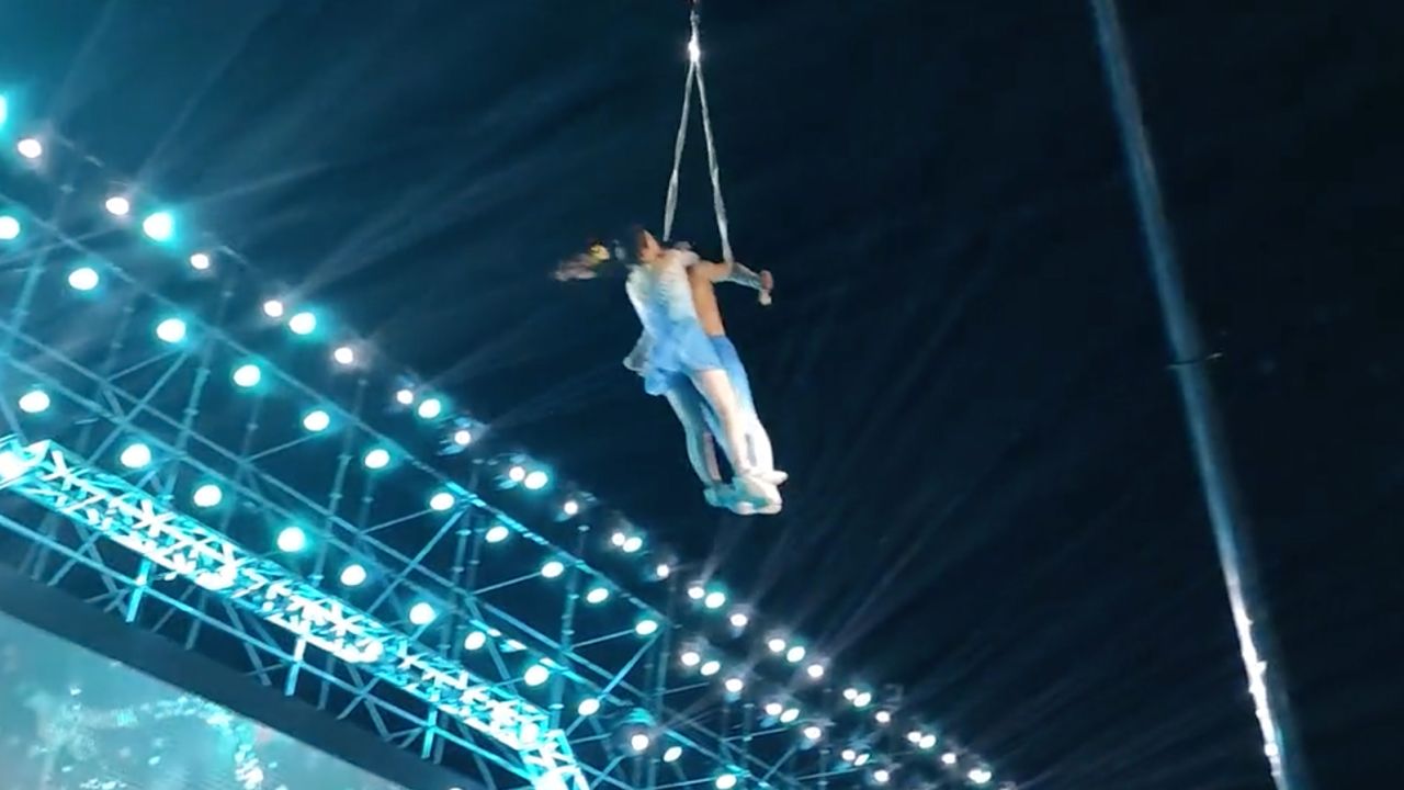 This screengrab shows the two acrobats being lifted into position during an aerial silks performance in China's central Anhui province moments before the fatal fall.