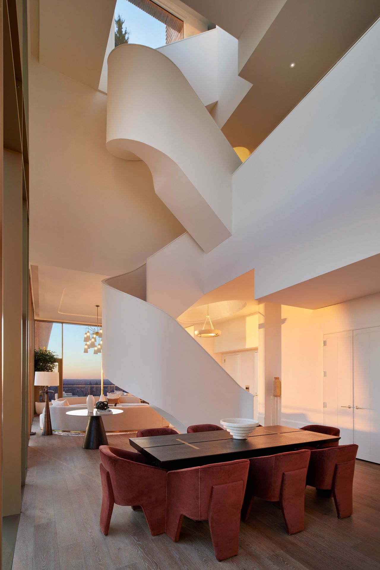A spiral staircase leads to the second floor and to the roof landing.