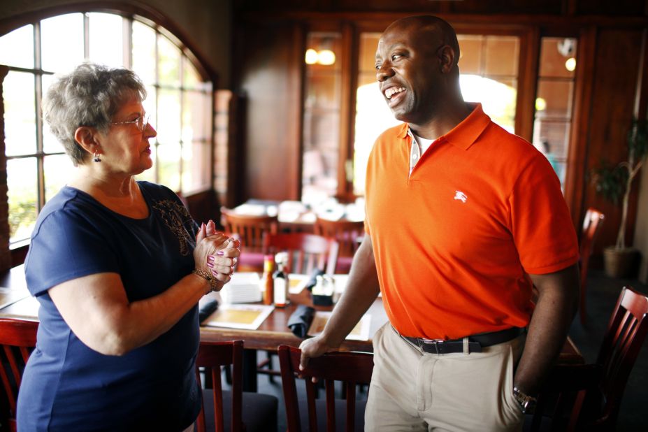Scott, campaigning for a seat in the US House of Representatives, speaks with supporter Carol Kinsman at a restaurant in Myrtle Beach, South Carolina in June 2010. In 2008, Scott had won a seat in South Carolina's House of Representatives.