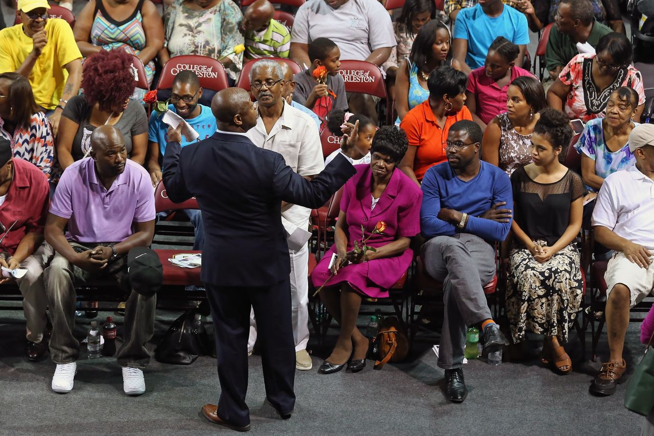 Scott talks with family members of those killed in a Charleston church shooting in June 2015.