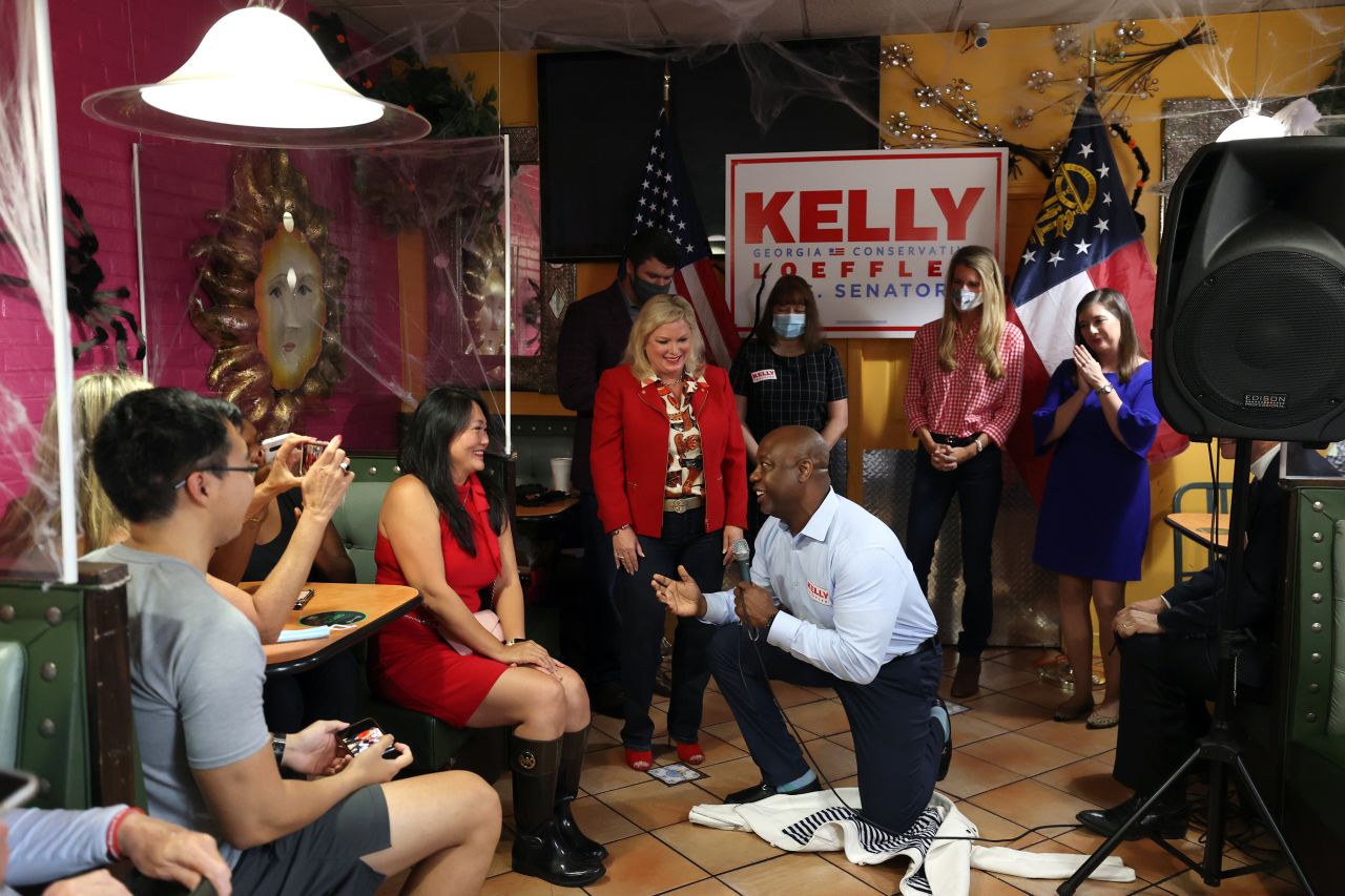 Scott pleads with a supporter to vote for US Sen. Kelly Loeffler during a campaign event in Doraville, Georgia, in October 2020.