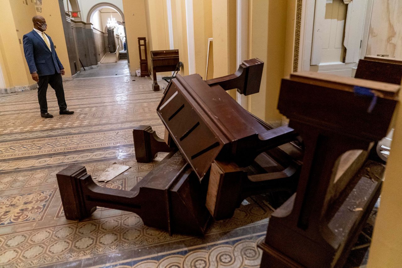 Scott stops to look at damage at the US Capitol on the morning after the riot on January 6, 2021.