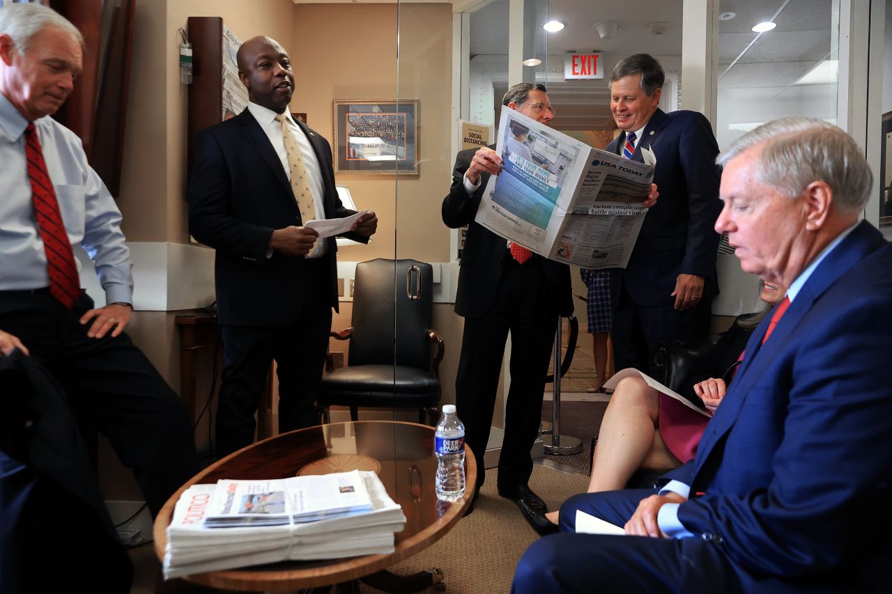 Scott and other Republican senators prepare for a news conference in July 2021. Graham, right, organized the conference to criticize what he called a Senate Democrats "spending spree."