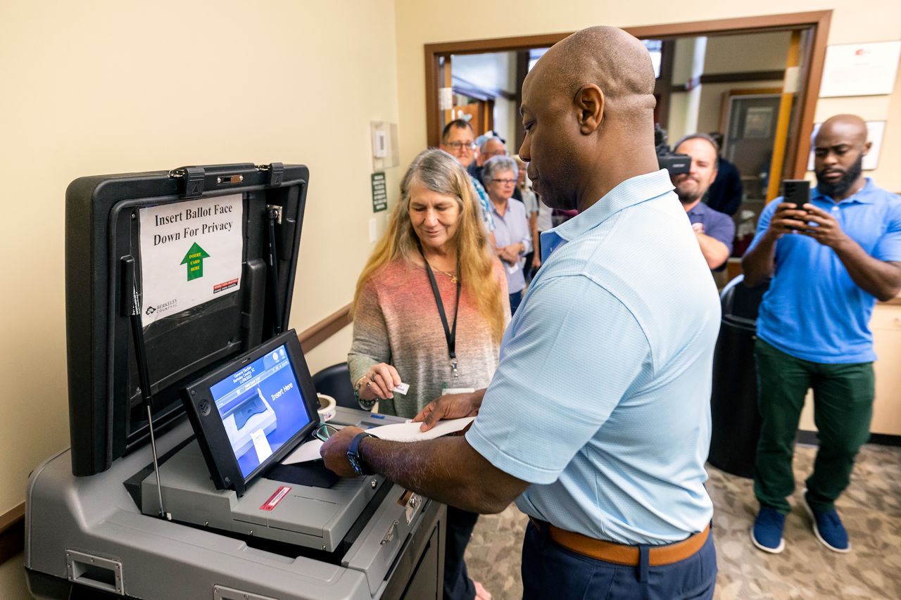 Scott submits his ballot during early voting in Hanahan, SC in October 2022. He was once again reelected.