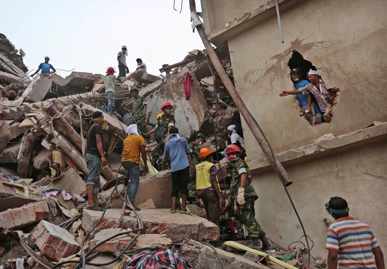 Rescue workers search for victims amid the rubble of the Rana Plaza building in Savar, near Dhaka, Bangladesh on April 26, 2013.
