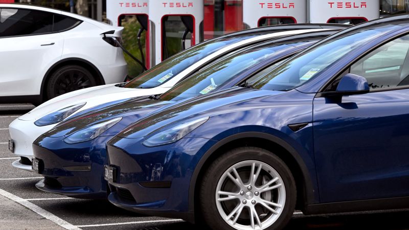 NextImg:Tesla revenue and profits fall after slashing car prices | CNN Business