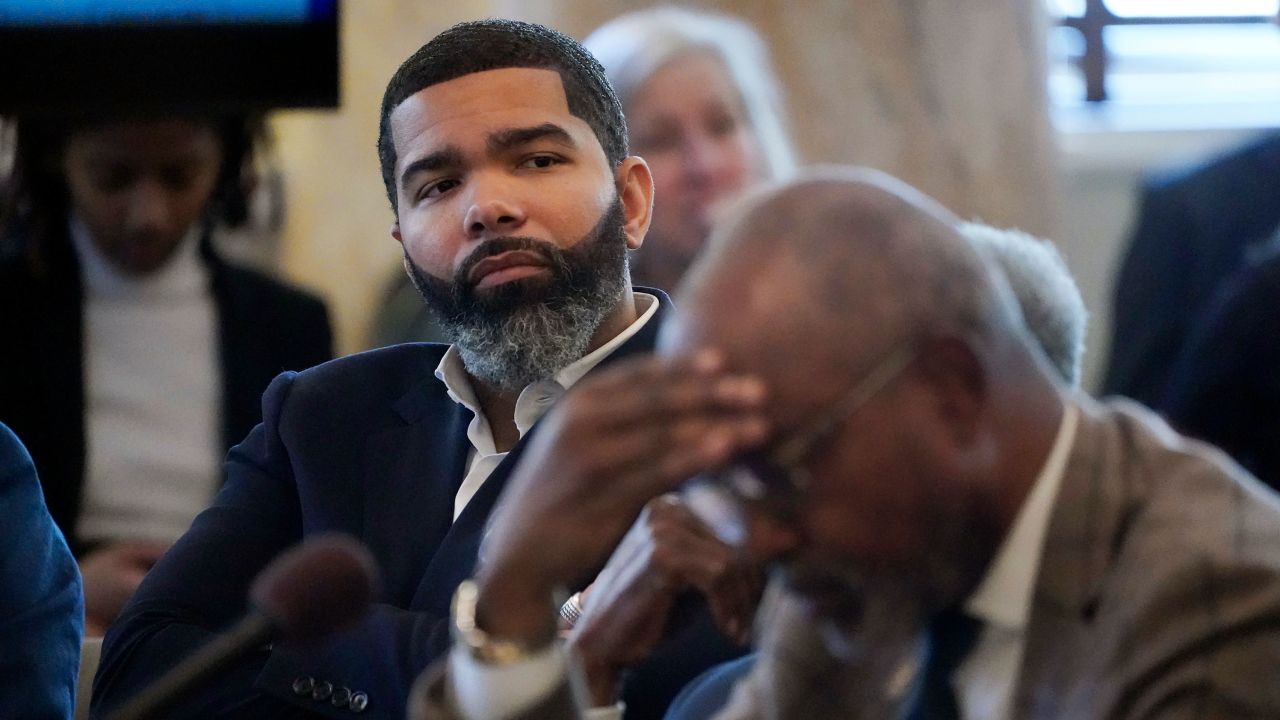 Jackson Mayor Chokwe Antar Lumumba, left, listens during a hearing hosted by the Jackson delegation of the Mississippi Legislature at the state Capitol in Jackson on Monday, March 6, 2023.