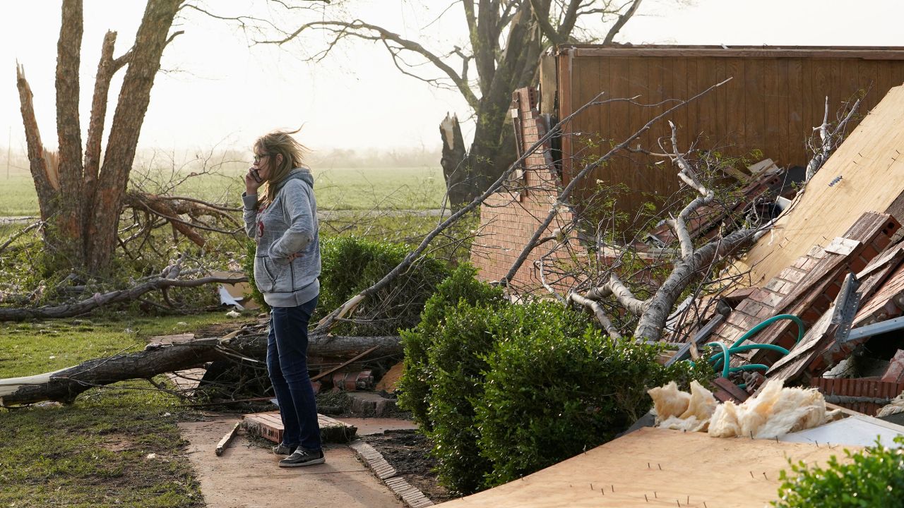 Robbie Bridwell surveys damage Thursday in Cole, Oklahoma.