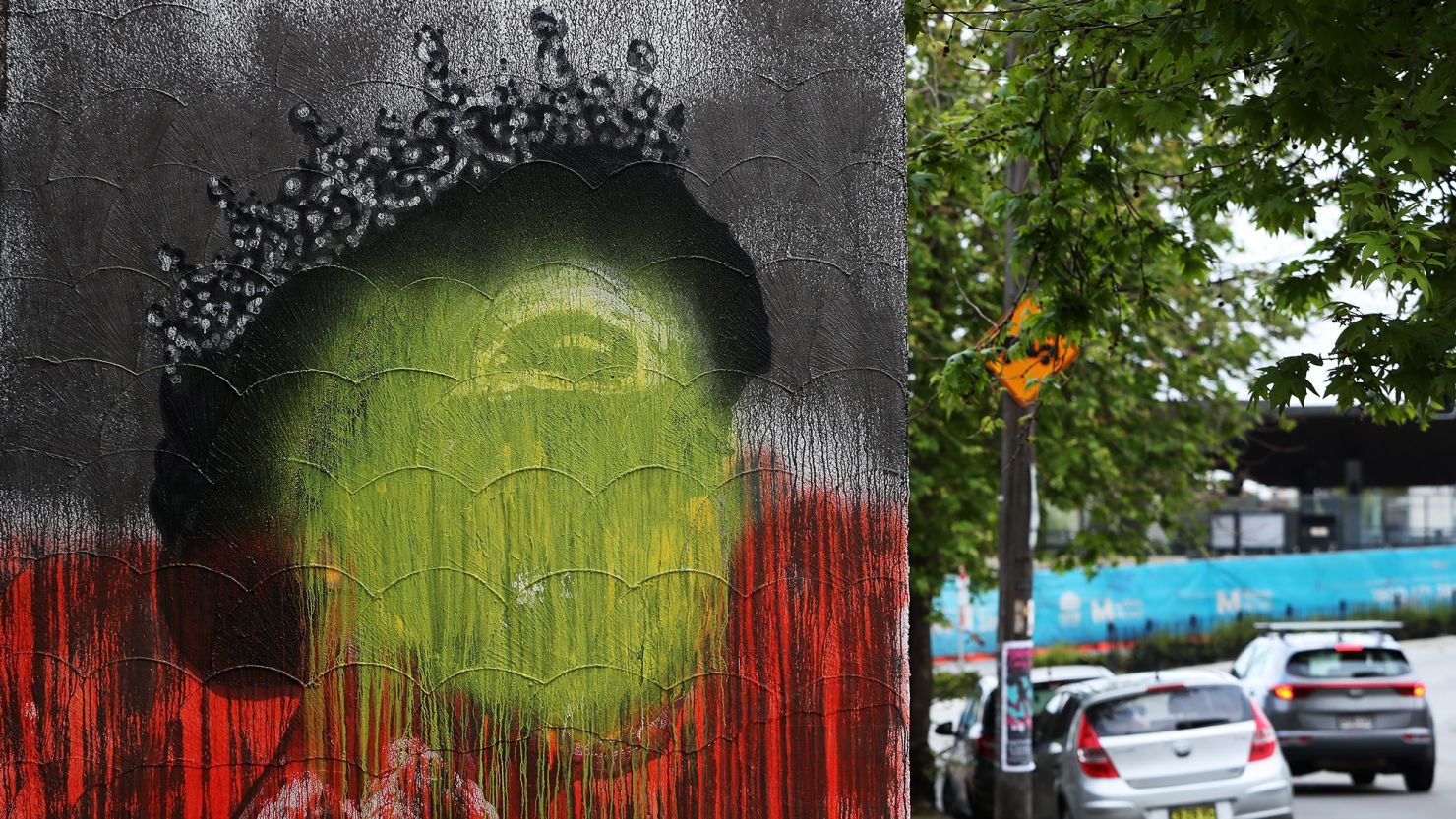 SYDNEY, AUSTRALIA - SEPTEMBER 22: A mural of the late Queen Elizabeth II by artist Stuart Sale has been painted over with the colours of the Aboriginal flag in Marrickville Thursday 22 September was declared a one-off public holiday as a National Day of Mourning for Australia following Queen Elizabeth II's death. (Photo by Lisa Maree Williams/Getty Images)