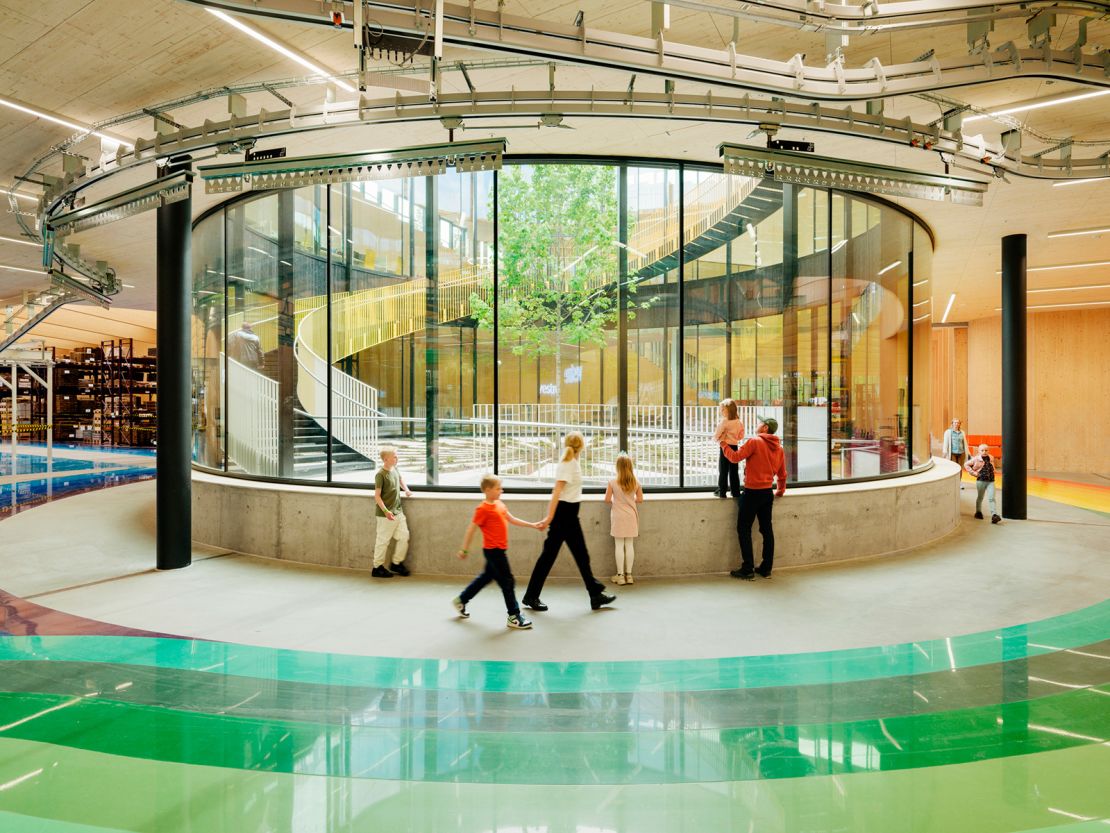 Central to the Plus factory's floorplan is a large panopticon.