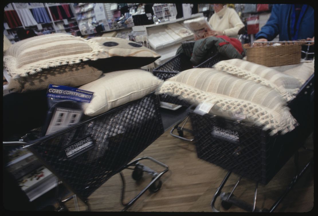 Customers examining items in shopping carts at a Bed, Bath & Beyond store in New York City on January 18, 1994.