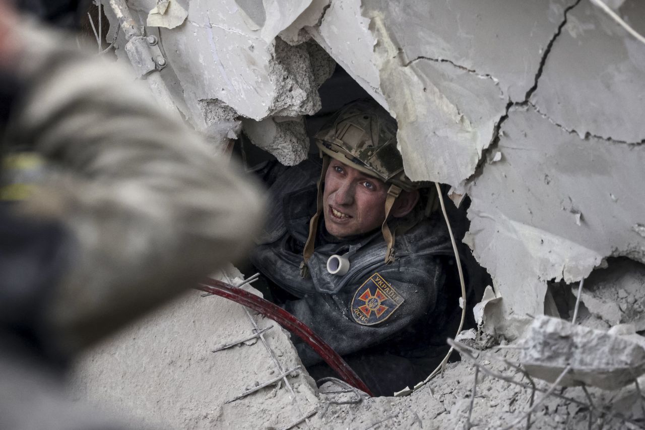 A rescuer searches for survivors in a residential building that was shelled in Sloviansk, Ukraine, on Friday, April 14. At least 11 people were killed and 22 were wounded in <a href="https://www.cnn.com/europe/live-news/russia-ukraine-war-news-04-15-23/h_e6522dc060493011b76fcc6788de4d0d" target="_blank">Russian strikes</a> that pounded the city.