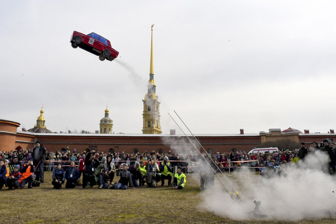 A model rocket that resembles a Soviet-era automobile is launched near the Peter and Paul Fortress in St. Petersburg, Russia, on Sunday, April 16. It was part of celebrations marking the 62nd anniversary of <a href="https://www.cnn.com/2021/04/12/world/space-race-yuri-gagarin-scn/index.html" target="_blank">Yuri Gagarin</a> becoming the first man to travel to space.