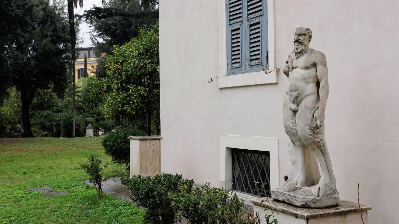A statue of Pan by Michelangelo is seen outside Villa Aurora.