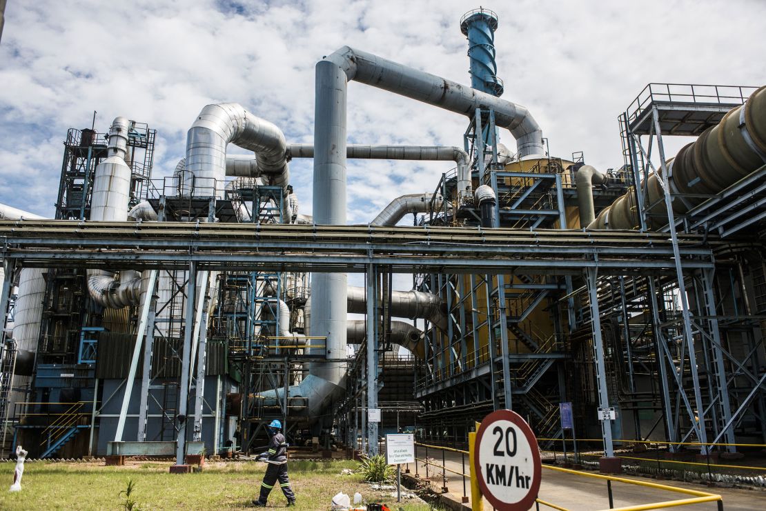 A mine worker walks past conveyors and pipe systems at the concentrator plant at the Nchanga copper mine, operated by KCM, in Chingola, Zambia.