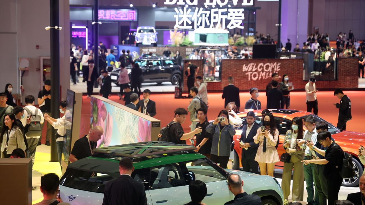People visit the Mini booth at the Shanghai International Automobile Industry Exhibition on April 18, 2023.