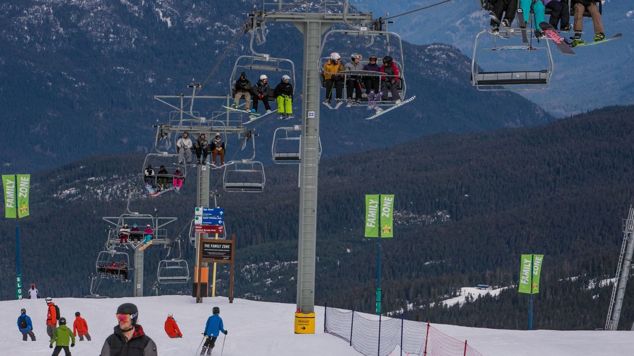 Skiers ride the main chair lift to the top of Whistler Mountain in British Columbia, Canada.