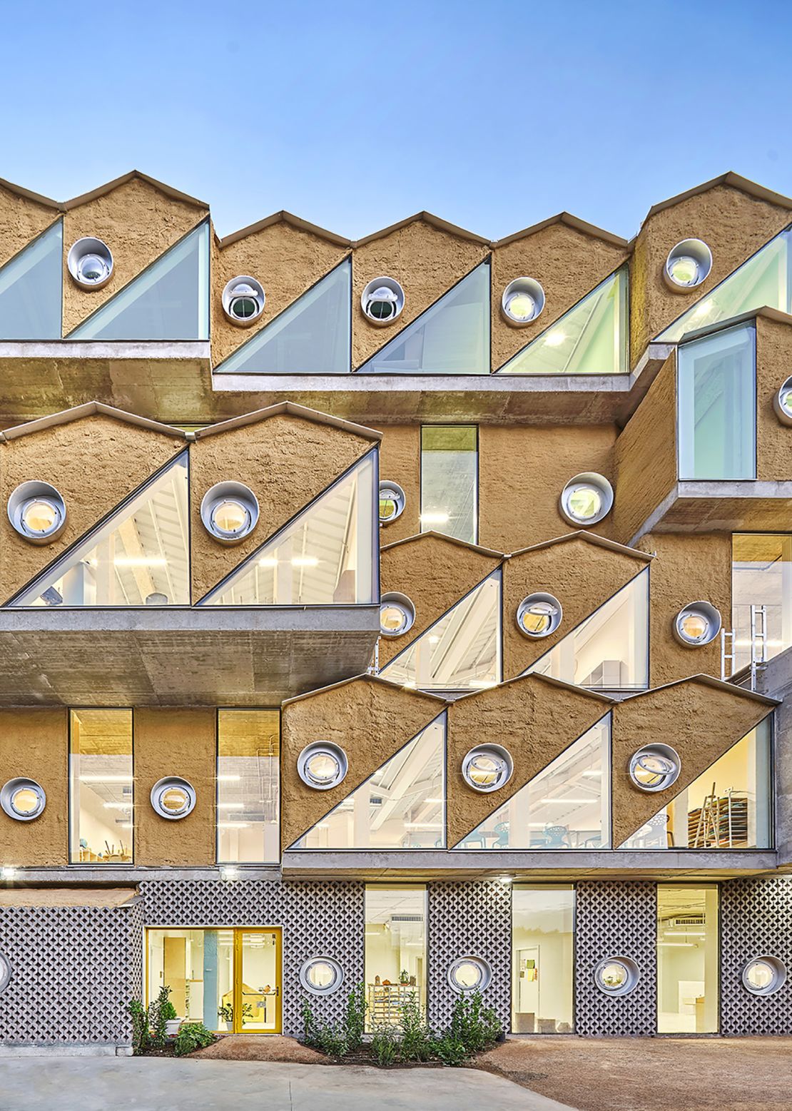 The Reggio School features a cork facade to encourage biodiversity.