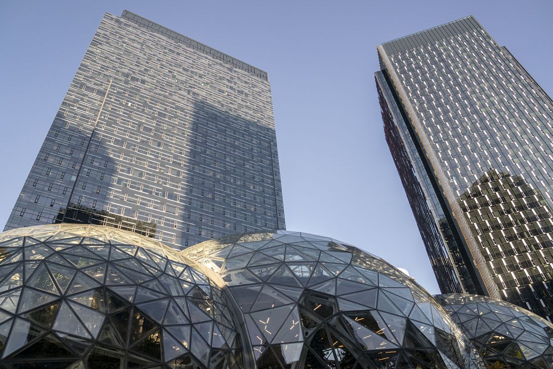 Corporate office buildings rise above The Spheres at the Amazon.com Inc. headquarters on November 14, 2022 in Seattle, Washington.