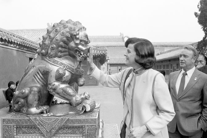 Feinstein touches the nose of a bronze lion at the Forbidden City in Beijing during a visit to China in 1984.