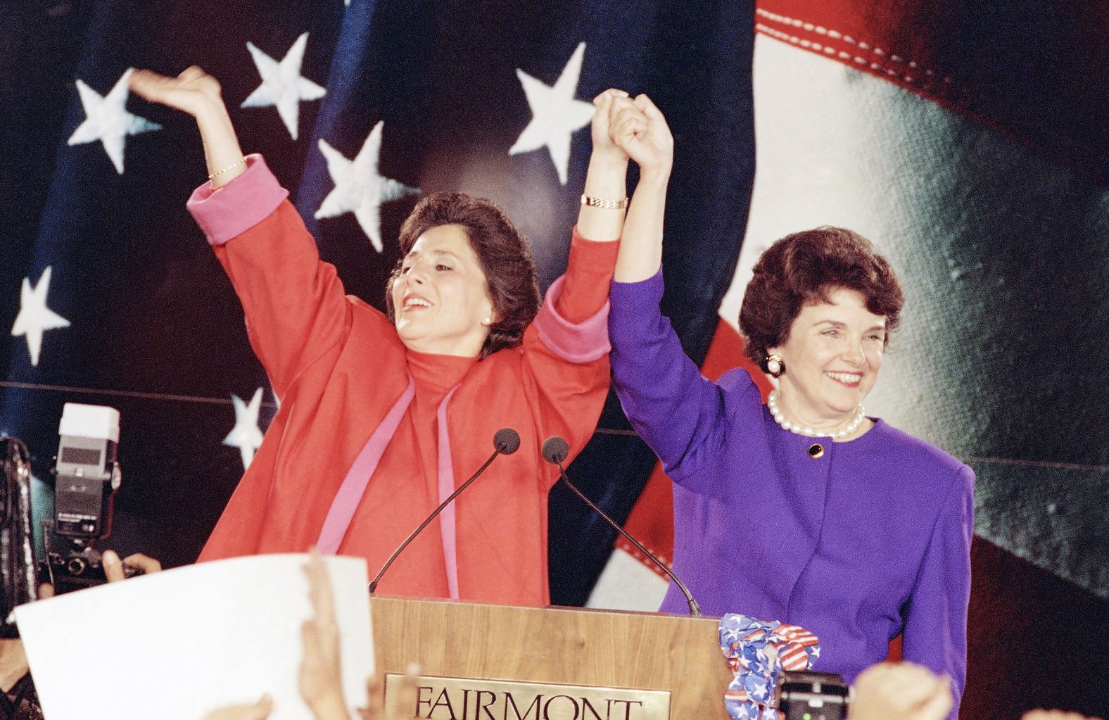 Barbara Boxer and Feinstein raise their arms in victory at an election rally in San Francisco in November 1992. The two women claimed victory over their male Republican rivals.