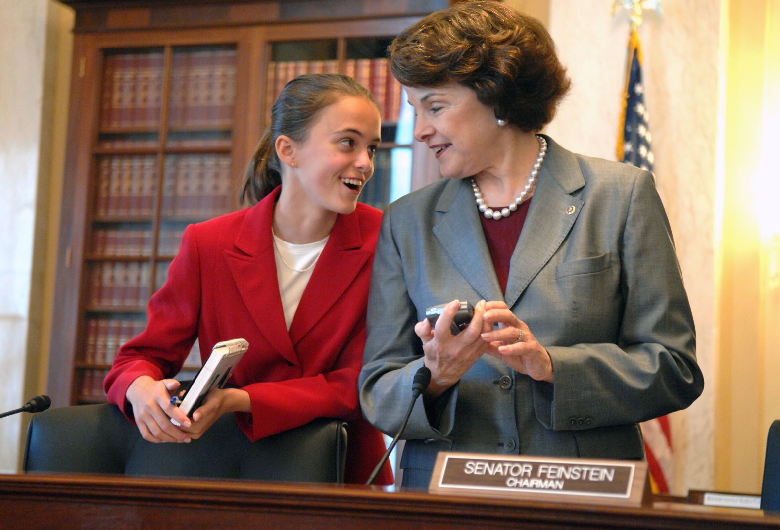 Feinstein talks to her 14-year-old granddaughter, Eileen Mariano, before a Senate Rules and Administration Committee hearing in 2006 on the Fair Elections Now Act, which sought to reform the finance of Senate elections. Mariano was interning in the senator's office.