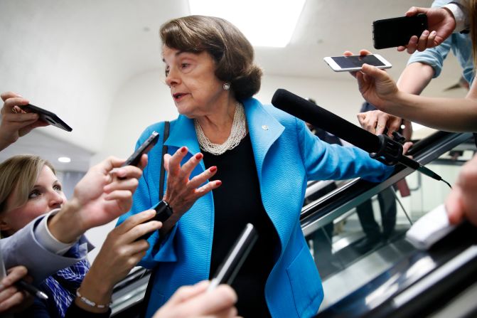 Reporters surround Feinstein as she arrives on Capitol Hill for a vote in 2018.