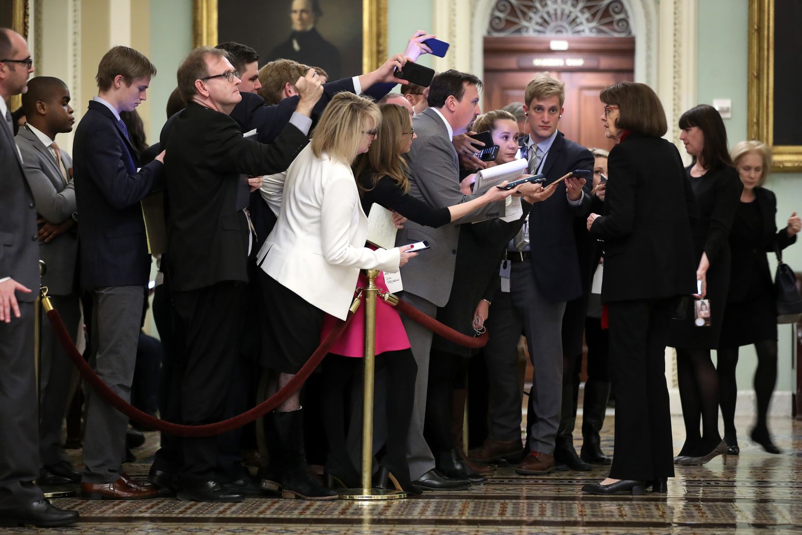 Feinstein talks to reporters during a break in the impeachment trial of President Donald Trump in 2020.