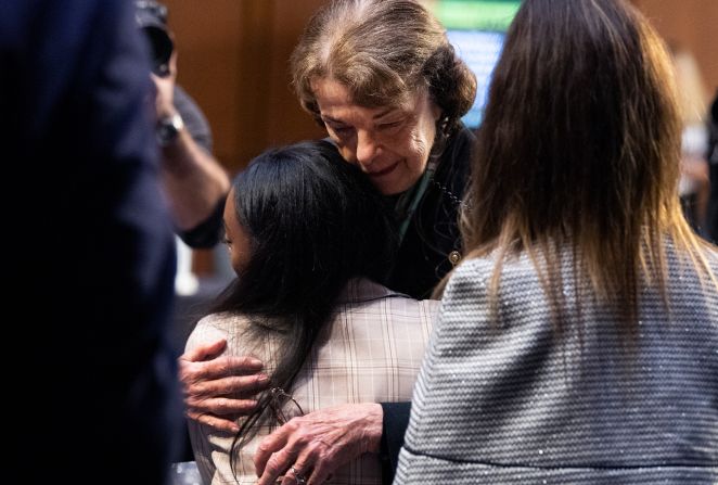 Feinstein hugs US Olympic gymnast Simone Biles after a Senate Judiciary Committee hearing on the FBI's handling of the Larry Nassar investigation in 2021. Gymnasts Aly Raisman, Maggie Nichols and McKayla Maroney also testified.