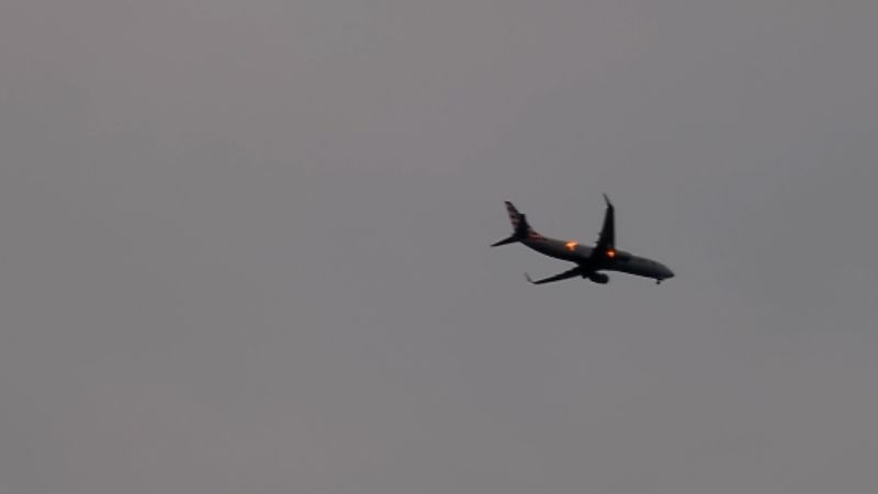 Watch: A jogger overheard a plane in the sky. See what happened next | CNN