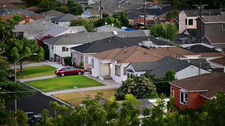 Green grass lawns seen in front of homes in a Los Angeles, California neighborhood on July 5, 2022.
