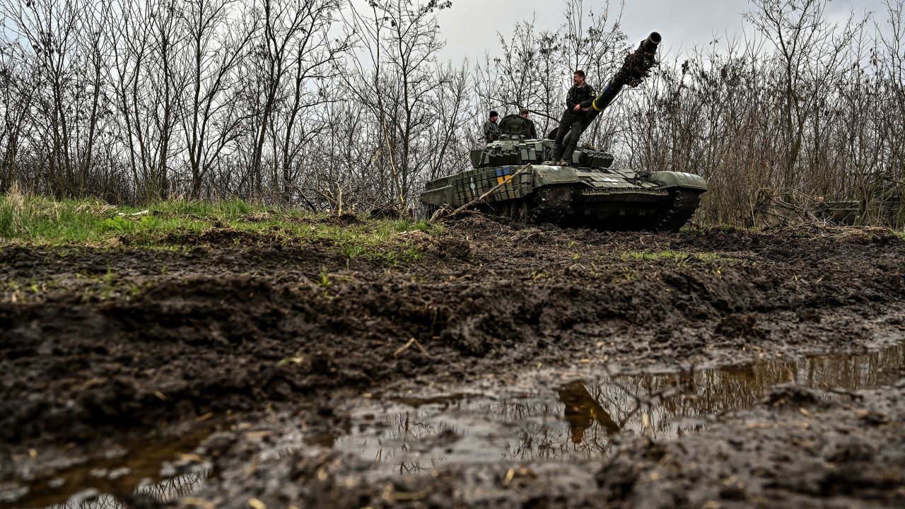 Ukrainian service members stand on top of a tank at a military training ground near a front line in Ukraine's Zaporizhzhia region, on April 5, 2023.