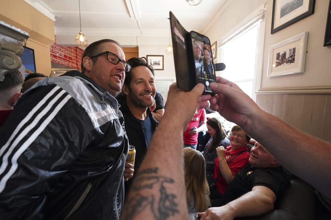 Rudd appears in photographs alongside Wrexham fans in The Turf Pub ahead of Saturday's match.