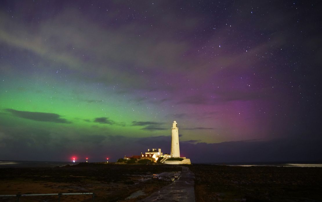 The northern lights were visible over St. Mary's lighthouse in Whitley Bay, England on Monday.