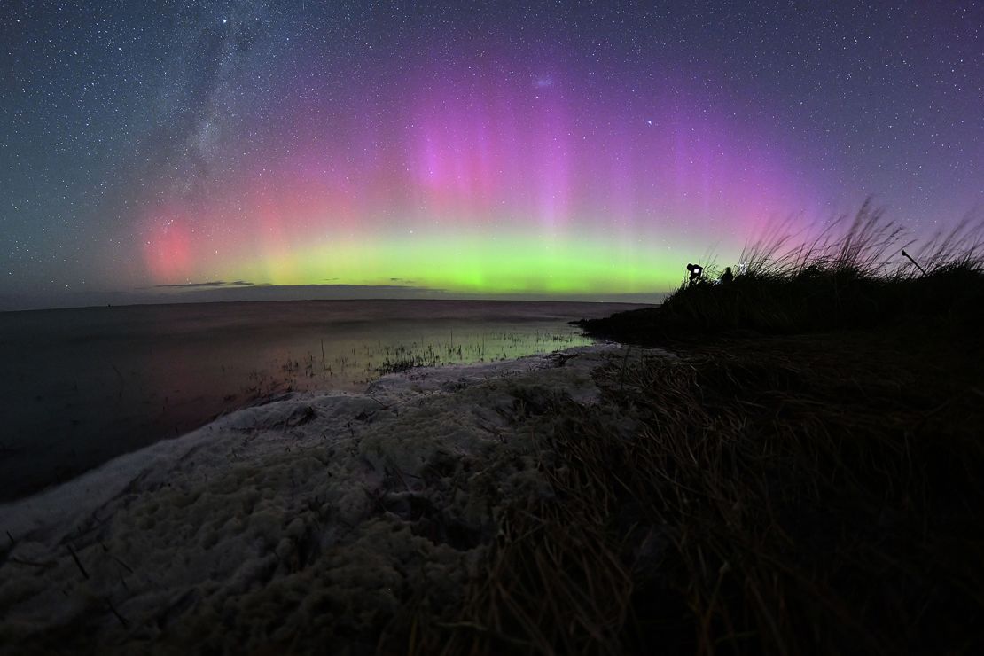 The southern lights glowed over Lake Ellesmere on the outskirts of Christchurch, New Zealand on Monday.