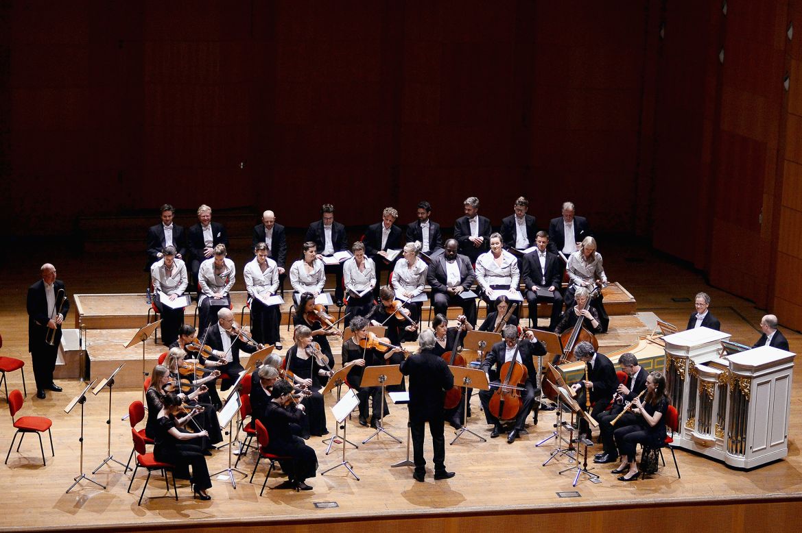John Eliot Gardiner (center) will conduct the English Baroque soloists and the Monteverdi Choir (pictured Bologna, Italy, May 2018) as part of the pre-service program.