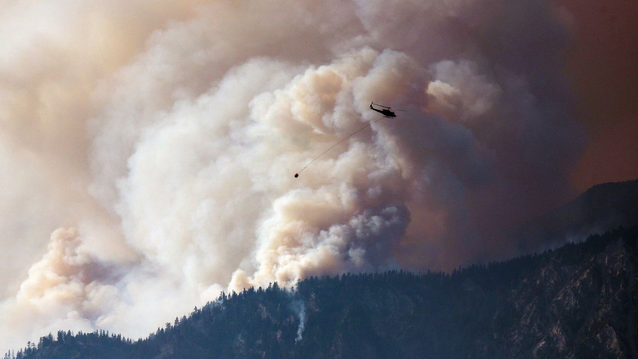 Smoke billows along the Fraser River Valley near Lytton, British Columbia, Canada, on July 2, 2021. A protracted heat wave fueled scores of wildfires in Canada's western provinces.
