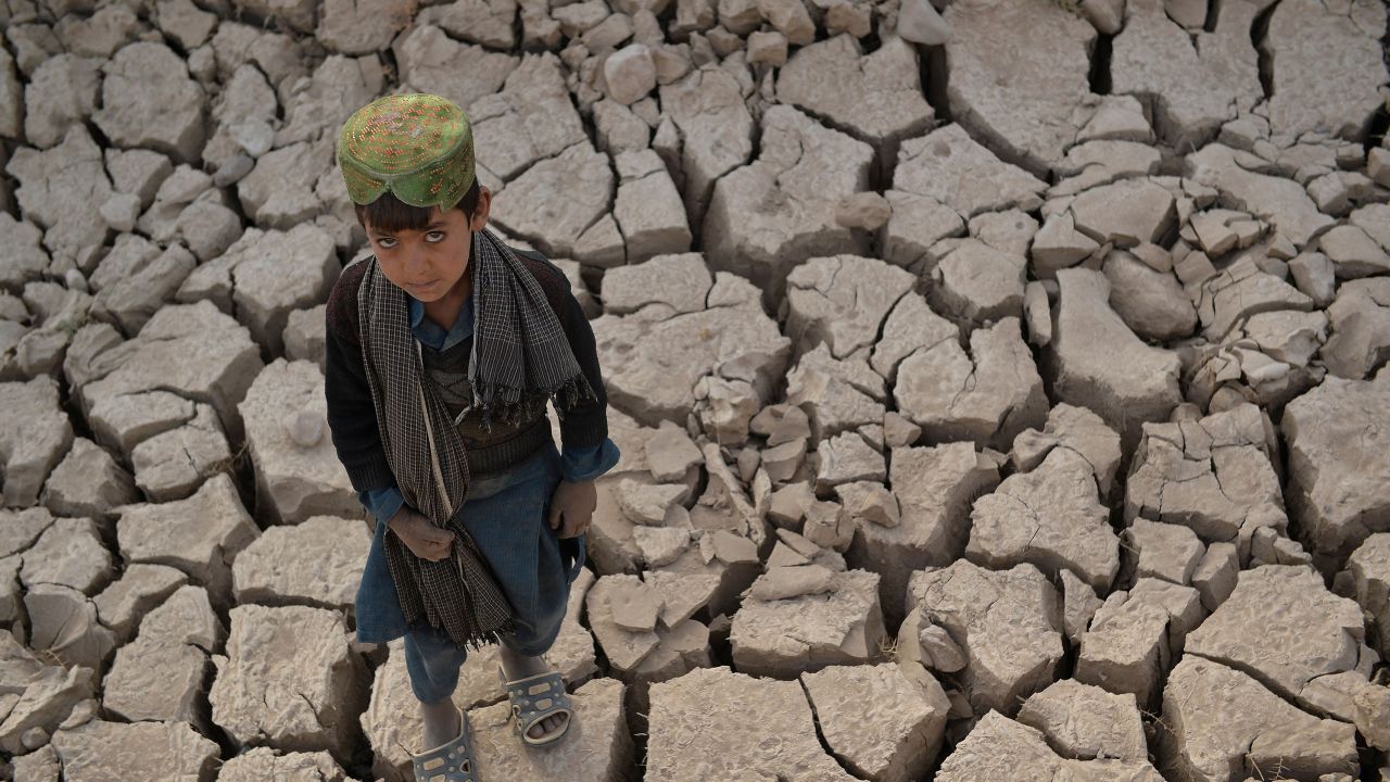 A child standing on a dry land in Bala Murghab district of Badghis province, Afghanistan in October 2021.