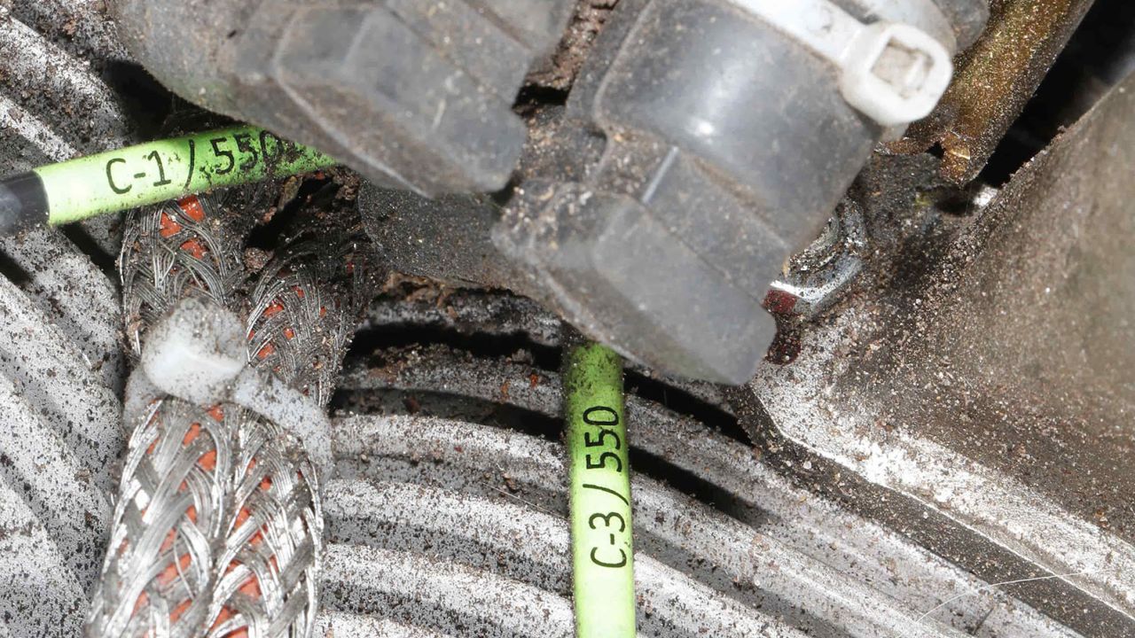 Cables in the Mado engine, displaying labels that probably refer to the MD-550 model designation documented by a CAR field investigation team in Kyiv, Ukraine, on 20 January 2023.