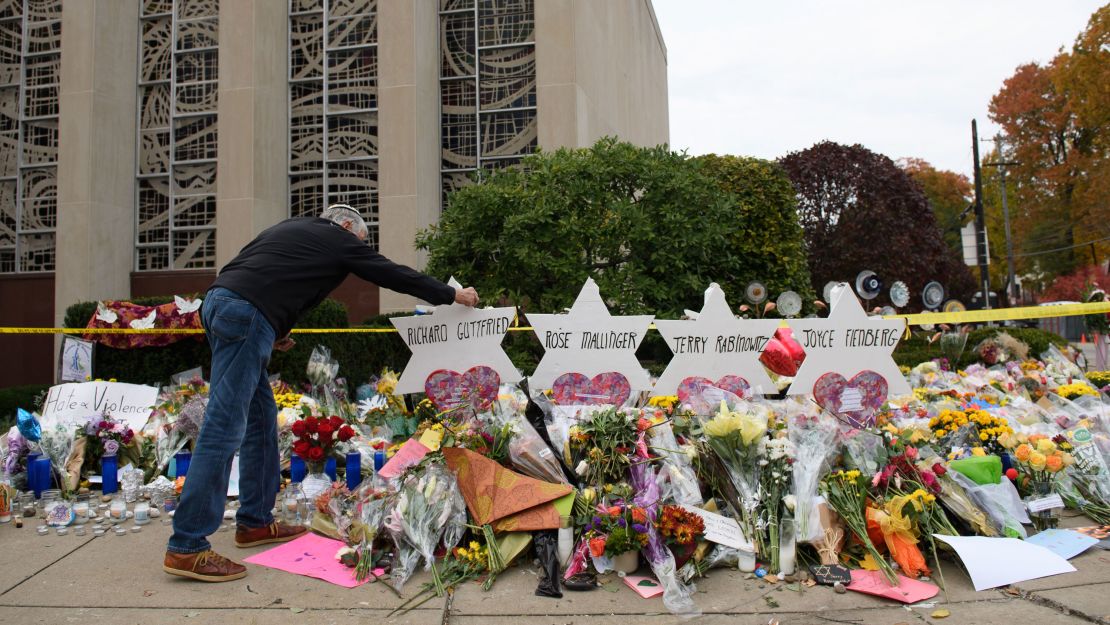 Mourners visit the memorial outside the Tree of Life Synagogue on October 31, 2018 in Pittsburgh, Pennsylvania.
