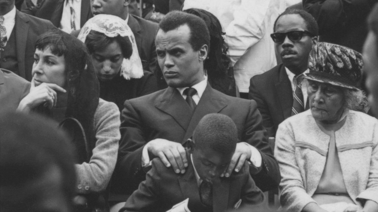 Harry Belafonte, center, with his wife Julie Robinson, left, at Dr. Martin Luther King Jr.'s funeral.