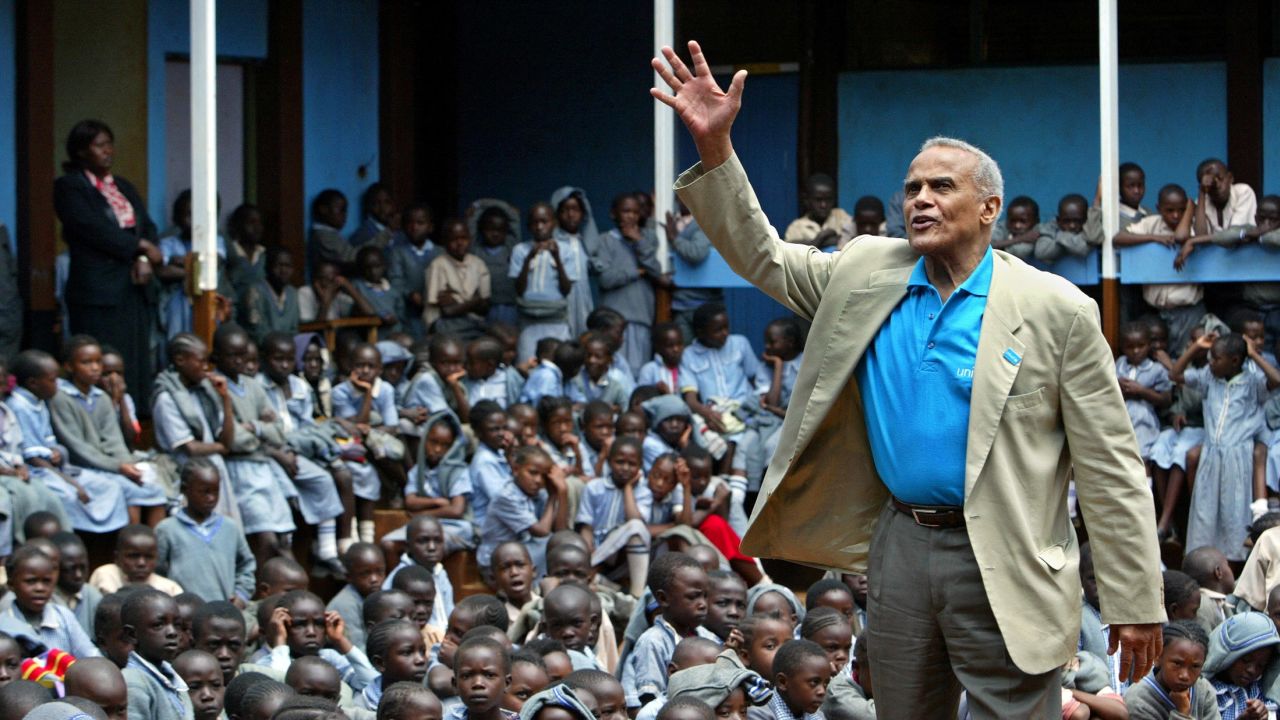 Harry Belafonte addresses students at a primary school near Kenya's capital Nairobi in 2004.