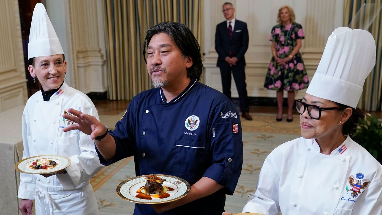 Guest Chef Edward Lee, center, flanked by White House Executive Pastry Chef Susie Morrison, left, and White House Executive Chef Cris Comerford, right, talks about Wednesday's state dinner menu. 