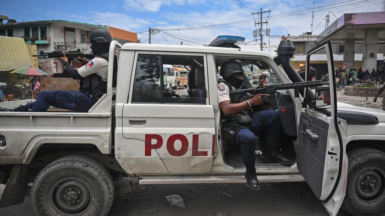 Police officers patrol a neighborhood amid gang-related violence in downtown Port-au-Prince on April 25, 2023. 